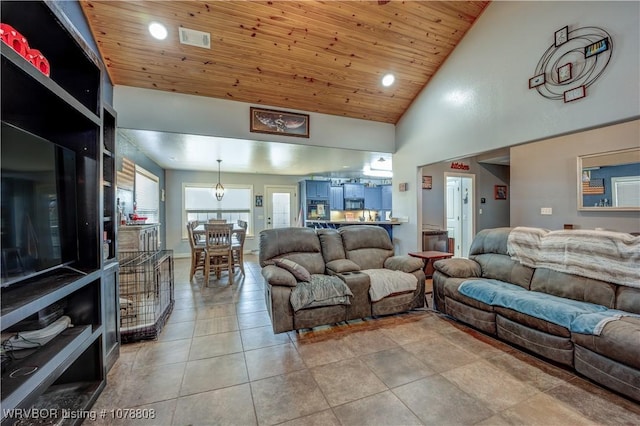 living room with light tile patterned floors, wooden ceiling, and high vaulted ceiling