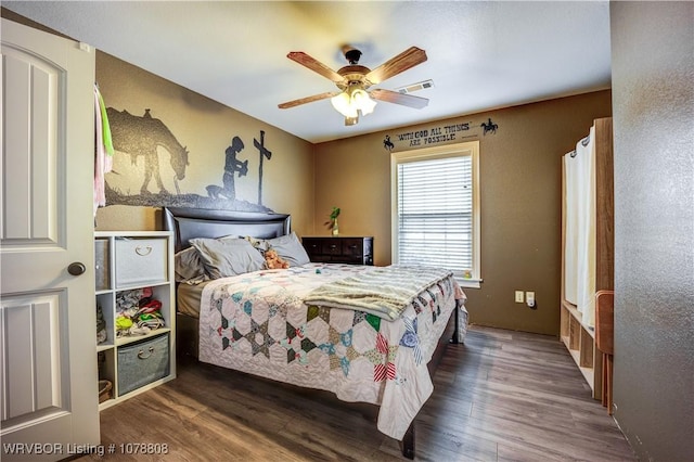 bedroom featuring dark hardwood / wood-style floors and ceiling fan