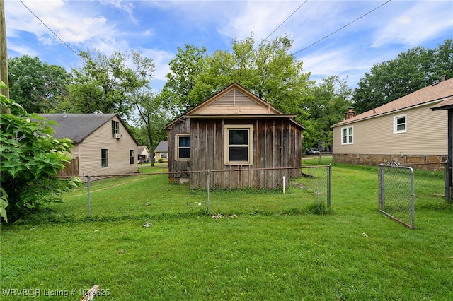 view of outbuilding featuring a gate and fence