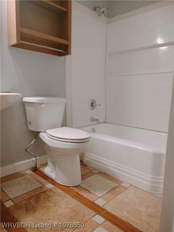 bathroom featuring toilet and shower / bath combination