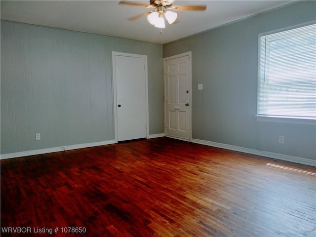 unfurnished room featuring hardwood / wood-style flooring and ceiling fan