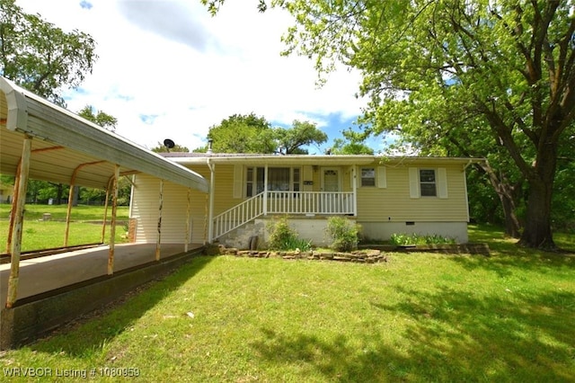 1126 S 2nd St, Stilwell, OK 74960 - view of front of property featuring a front lawn, crawl space, driveway, a carport, and a porch