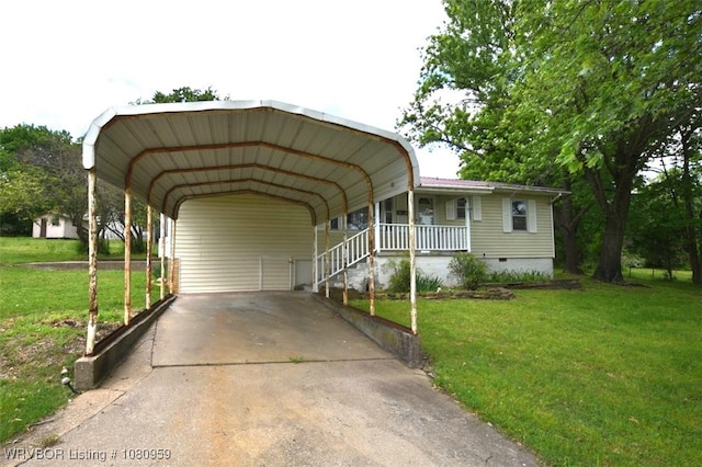 1126 S 2nd St, Stilwell, OK 74960 - view of front facade with a front yard, a carport, concrete driveway, crawl space, and covered porch