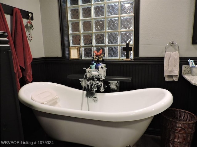 bathroom featuring a washtub