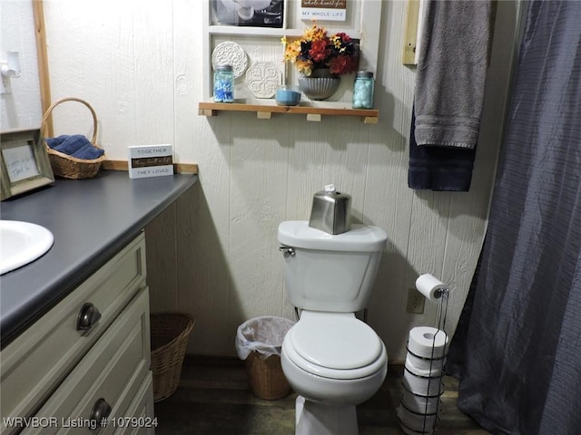 bathroom featuring vanity and toilet