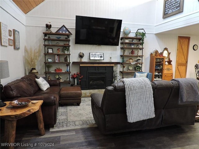 living room featuring vaulted ceiling and wood-type flooring