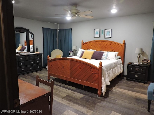 bedroom featuring ceiling fan and dark hardwood / wood-style flooring