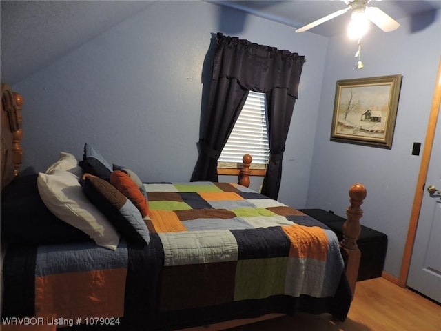 bedroom featuring hardwood / wood-style floors and ceiling fan