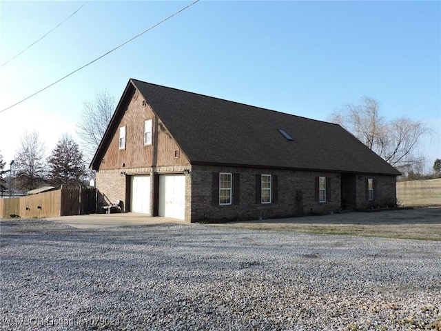 view of side of property with a garage