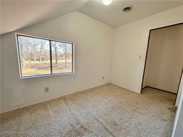 306 Ellis Loop, Pocola, OK 74902 - unfurnished bedroom featuring light colored carpet and vaulted ceiling