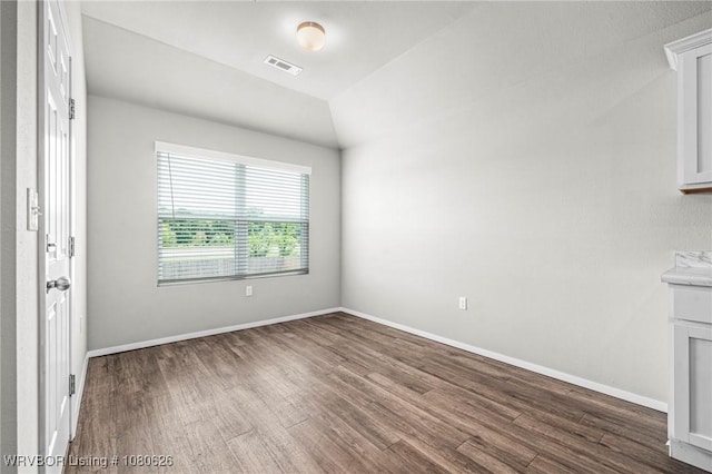 interior space with visible vents, dark wood-style flooring, and baseboards