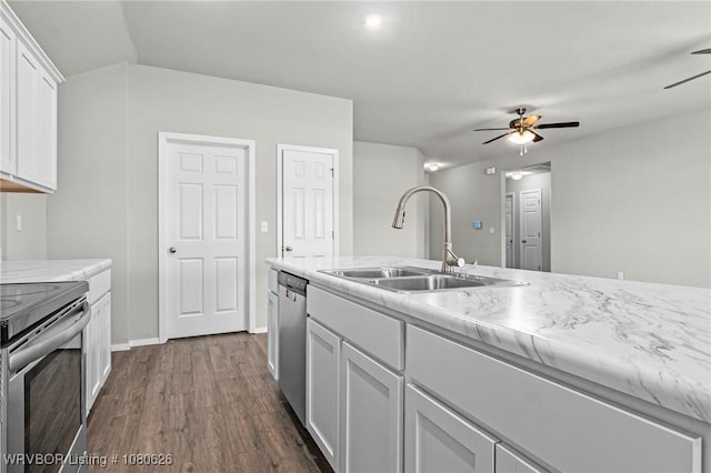 kitchen with ceiling fan, white cabinetry, a sink, dark wood finished floors, and appliances with stainless steel finishes