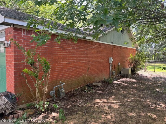 30 Easley Loop, Greenwood, AR 72936 - view of side of home featuring brick siding and a garage