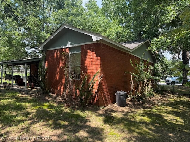 30 Easley Loop, Greenwood, AR 72936 - view of side of property with brick siding and a yard