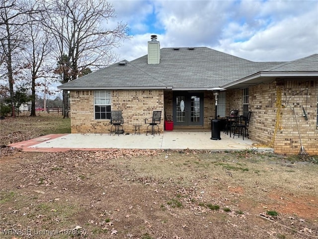 rear view of property featuring a patio area