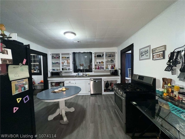 kitchen featuring white cabinetry, sink, stainless steel appliances, and dark hardwood / wood-style floors