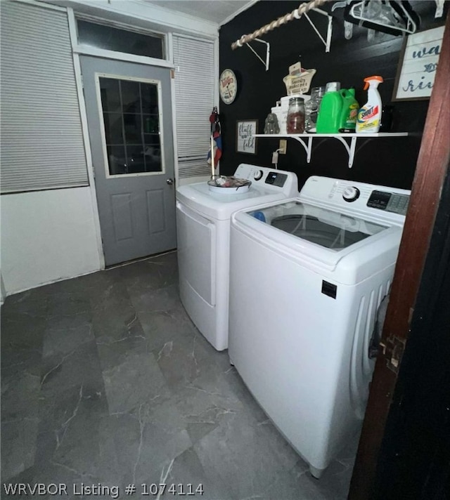 clothes washing area featuring independent washer and dryer