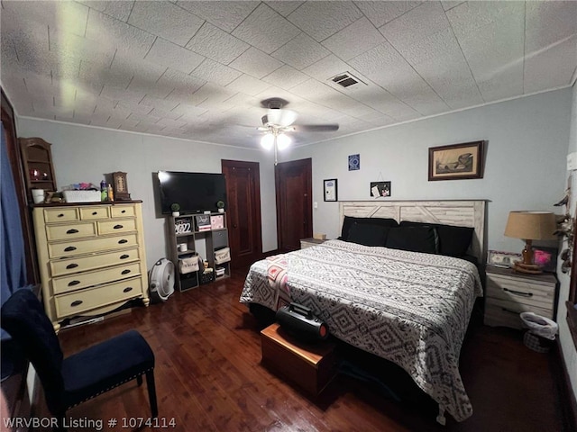 bedroom with ceiling fan and dark hardwood / wood-style flooring