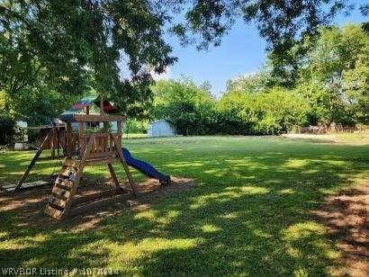 view of playground featuring a lawn