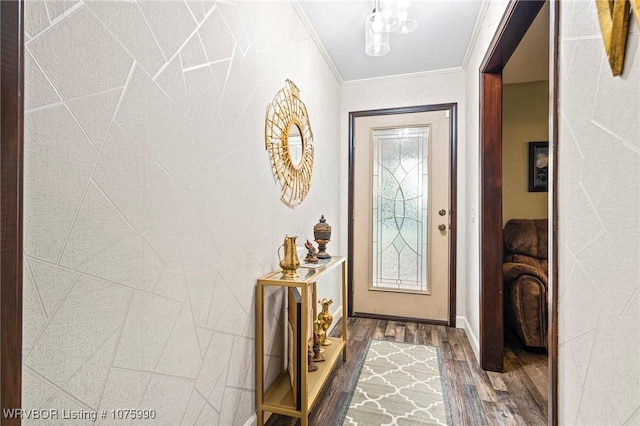 entryway with dark hardwood / wood-style floors and ornamental molding