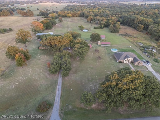 birds eye view of property with a rural view