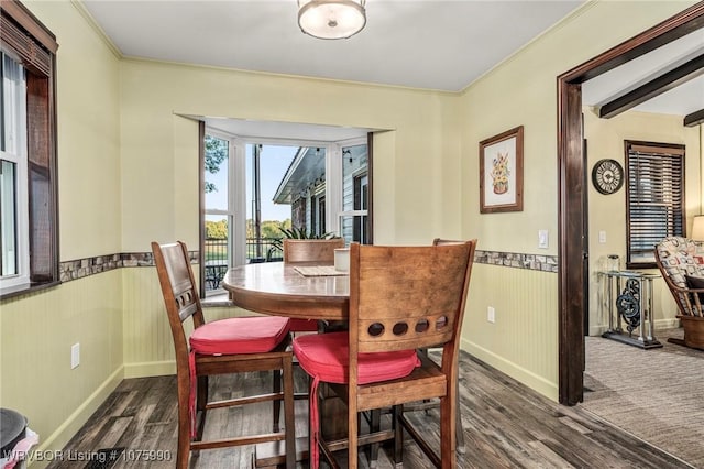 dining space with dark hardwood / wood-style floors