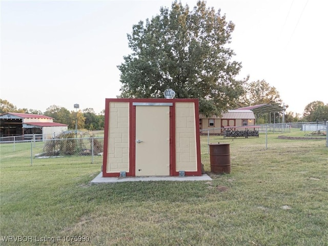 view of outbuilding featuring a yard