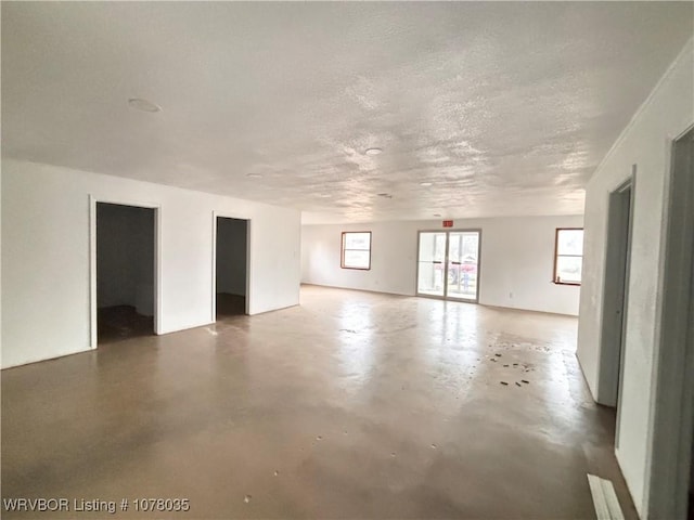 empty room featuring a textured ceiling