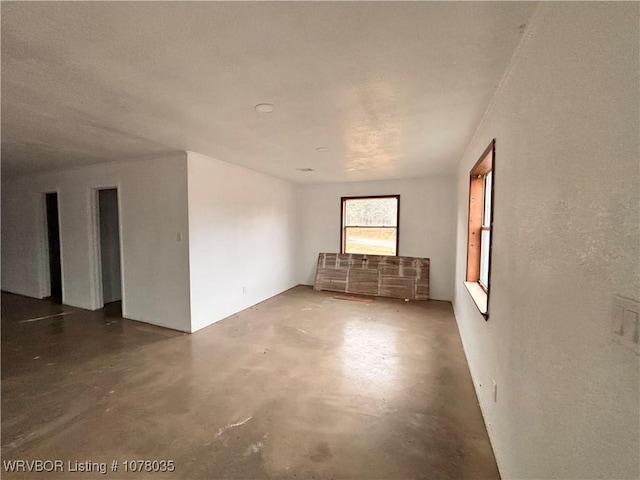 empty room featuring concrete flooring