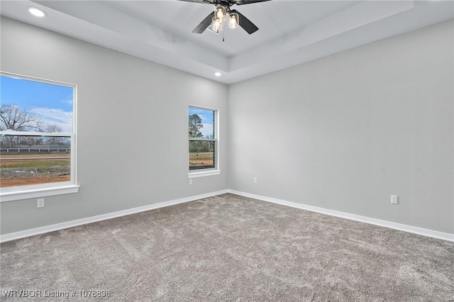 2006 Yellowstone Dr, Barling, AR 72923 - empty room with carpet flooring, ceiling fan, and a tray ceiling