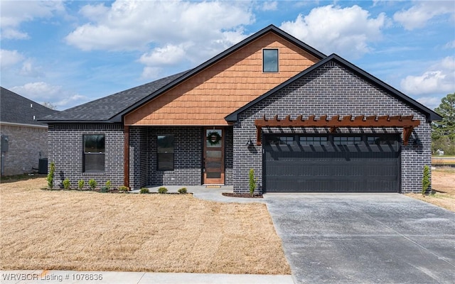 view of front of home with a garage and central AC unit