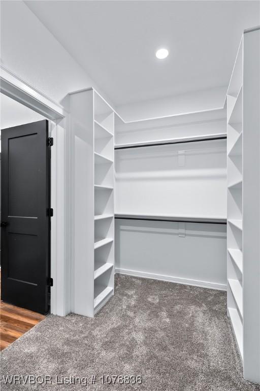 2006 Yellowstone Dr, Barling, AR 72923 - walk in closet featuring dark carpet