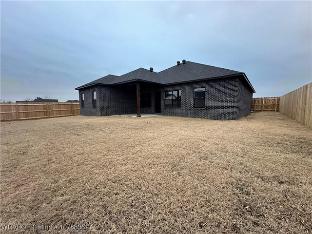 2006 Yellowstone Dr, Barling, AR 72923 - rear view of property with a lawn