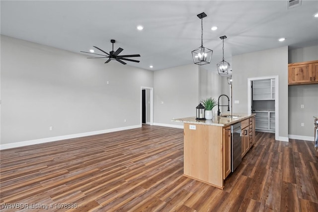 2006 Yellowstone Dr, Barling, AR 72923 - kitchen with pendant lighting, sink, a kitchen island with sink, light stone countertops, and dark wood-type flooring