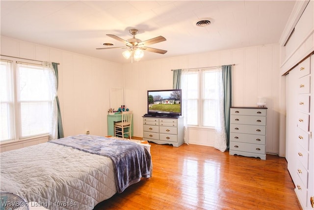 bedroom with ceiling fan and light wood-type flooring