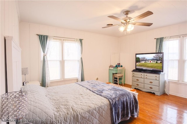 bedroom featuring ceiling fan and light hardwood / wood-style flooring