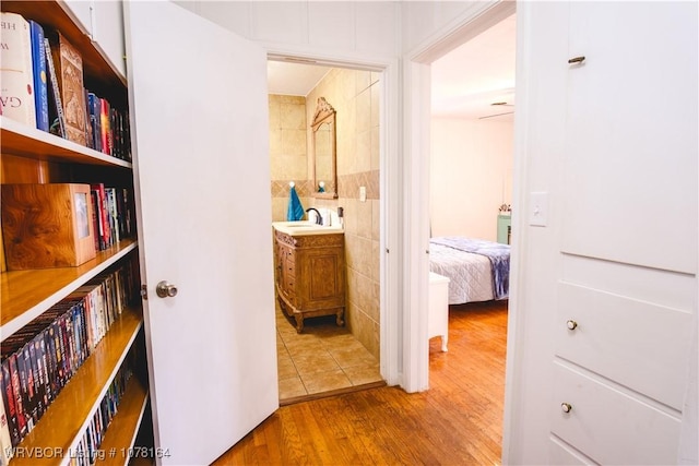 hall featuring sink and wood-type flooring