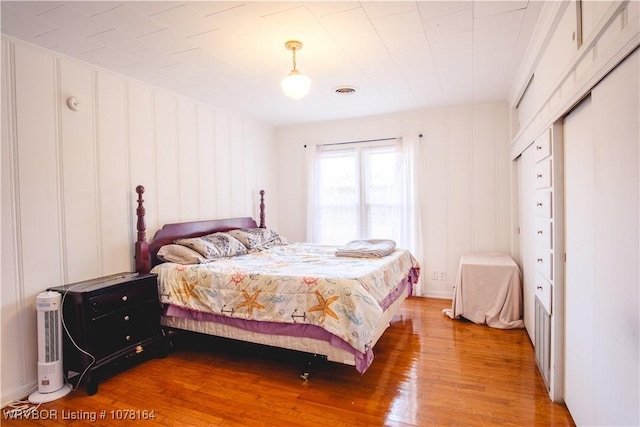 bedroom with hardwood / wood-style floors