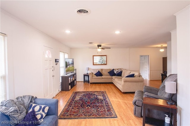 living room featuring ceiling fan and light hardwood / wood-style floors