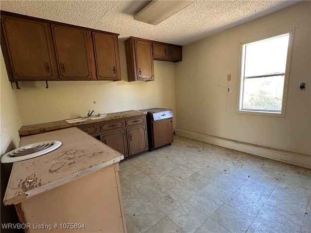 kitchen featuring sink and a textured ceiling