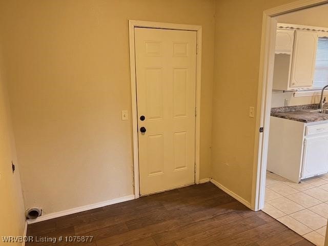 interior space featuring light wood-type flooring and sink