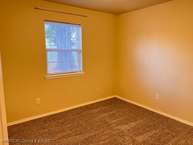 empty room featuring carpet flooring