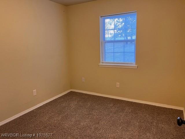 spare room featuring carpet flooring