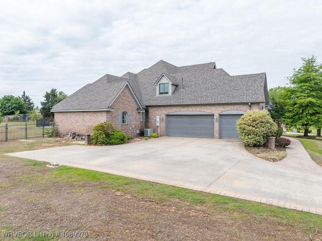 6800 Highland Park Dr, Fort Smith, AR 72916 - traditional-style home with central AC, brick siding, an attached garage, concrete driveway, and roof with shingles