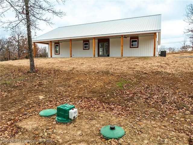 view of front of home with cooling unit and covered porch