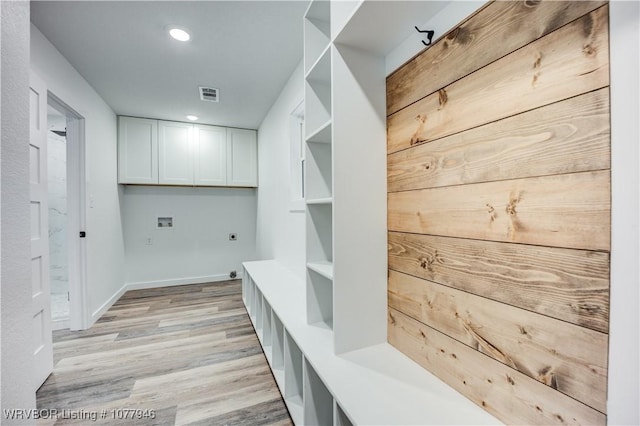 mudroom with light hardwood / wood-style floors