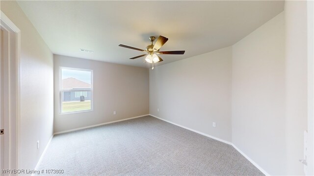 carpeted empty room with ceiling fan