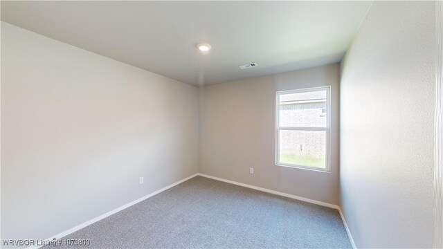 unfurnished room with carpet floors