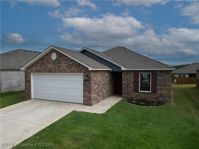 view of front of house with a front lawn and a garage