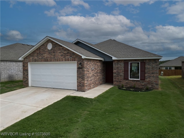 view of front of home with a garage and a front yard